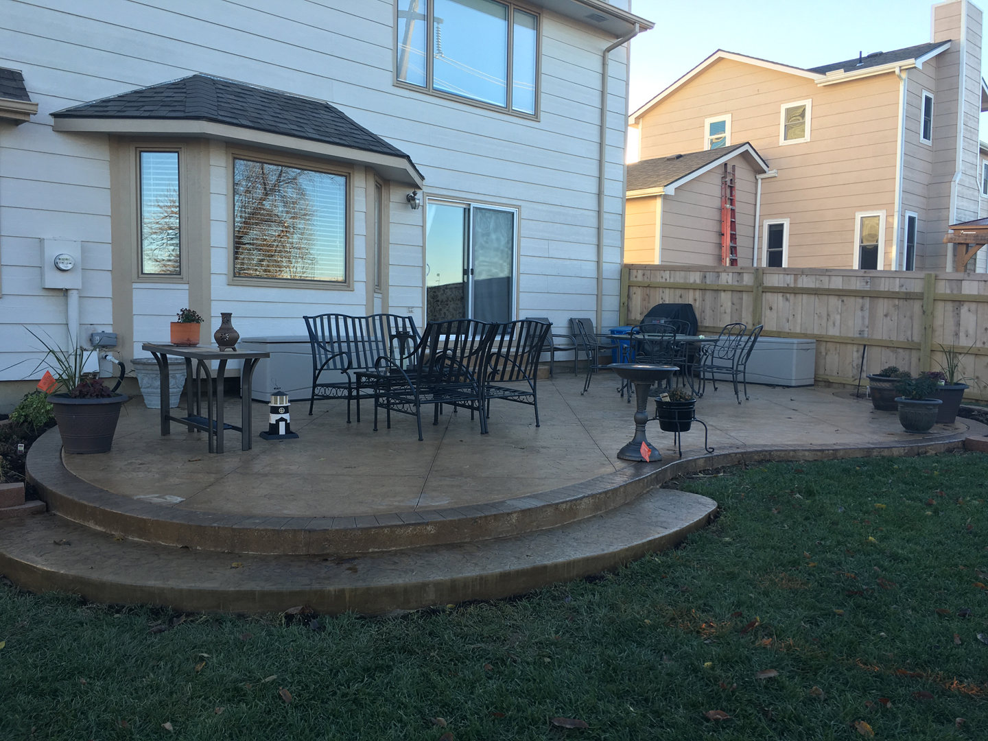 raised concrete patio against house